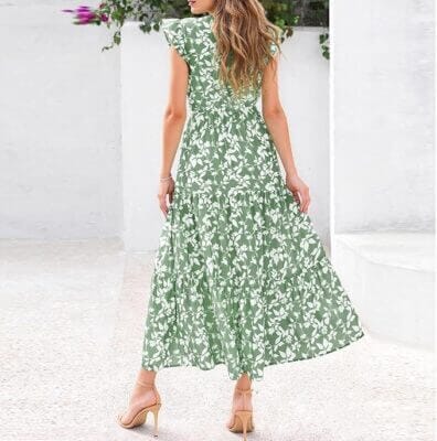 Langes Damenkleid mit floralem Muster und lockerem Schnitt.